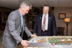 Former US Senator Scott Brown plays pinball at the home of NH state representative Charles McMahon on October 18, 2014